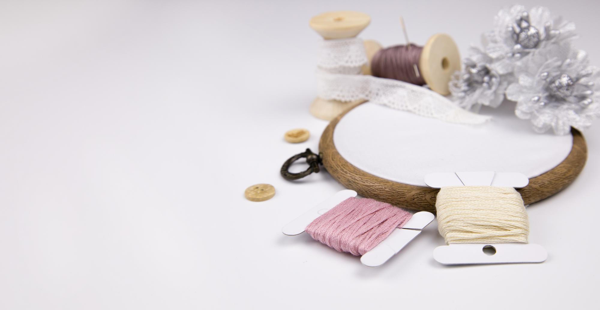 Thread palette and tools on wooden table